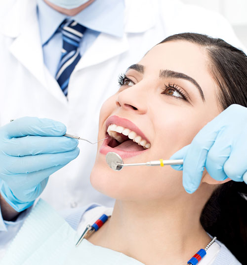 Dentist examine patient teeth